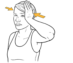 Woman holding hand to side of head doing neck isometric exercise.